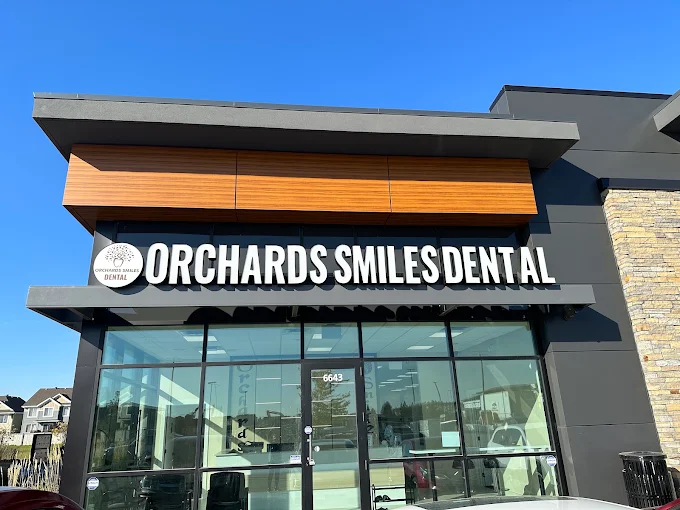 The Orchards Smiles Dental building at 6643 25 Ave SW in Edmonton, with the clinic sign above the entrance