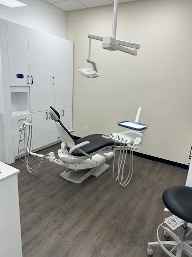 A private treatment room at Orchards Smiles Dental with a modern dental chair and overhead light